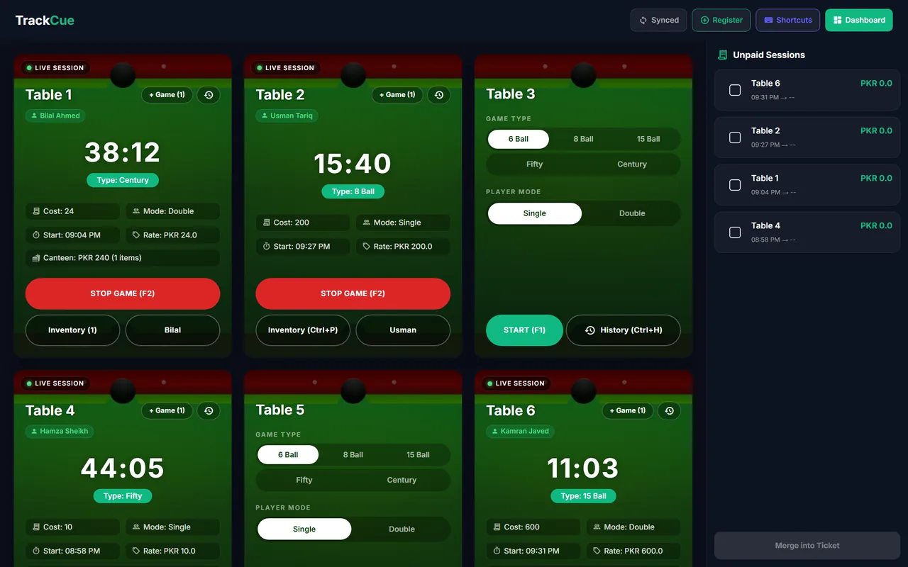 QUE TRACK live table screen on Windows with running timers, game types and an unpaid sessions panel